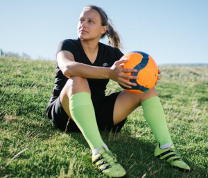 Woman holding soccer ball